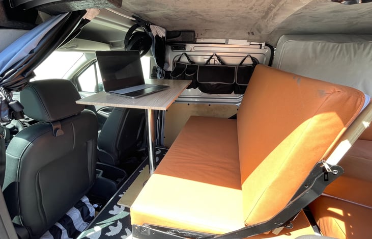 The computer stand in front of the bench  seat makes easy to work during the trip