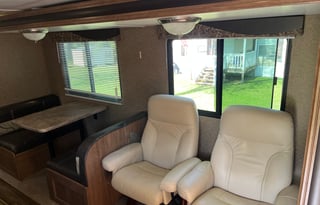 Camper with a queen living space and a bunkhouse.