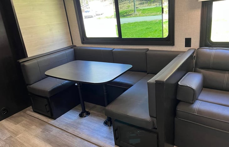 Dining area that seats our family of 6 - can add fold-up chair to the open side for more comfort.