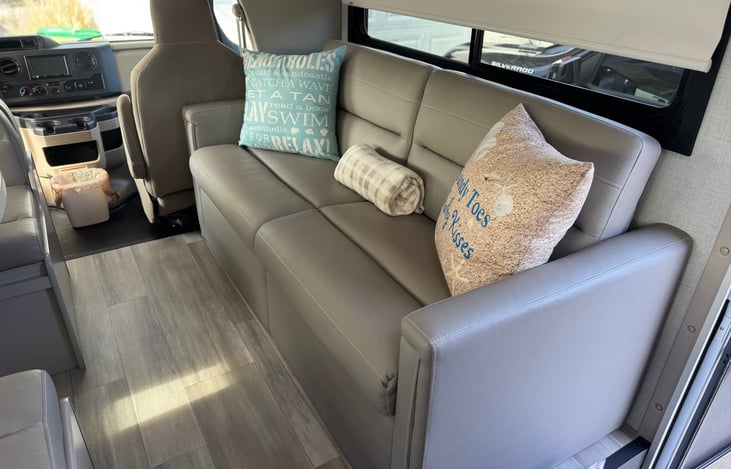 This comfy sofa easily folds into a bed in a matter of seconds.  Sofa is equipped with 3 seat belts for travel.