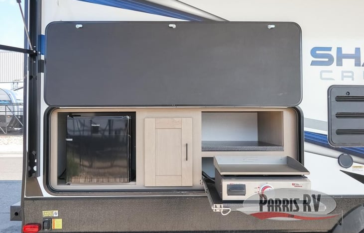 Out door kitchen! Open the hatch, attach the grill to the built in propane and get your grub on. This makes dinner time a breeze.