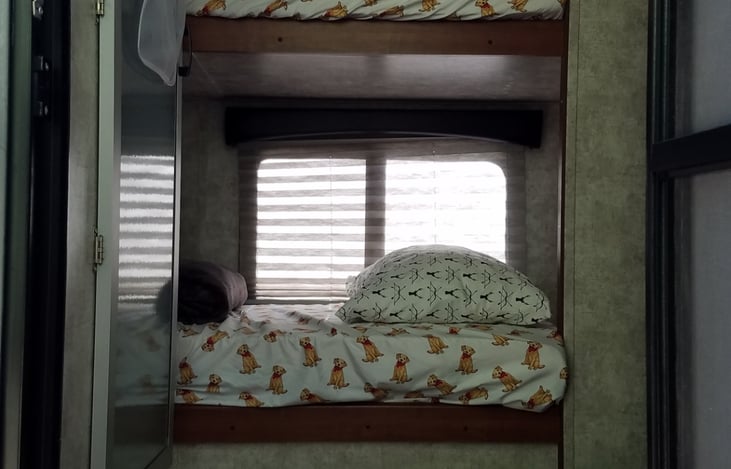 Memory foam mattresses on the 2 bunks, plenty of room with windows, each bunk  has a cubby cabinet and space for cell phone, small fan, small tote bag, whatever you need and wall plugins.