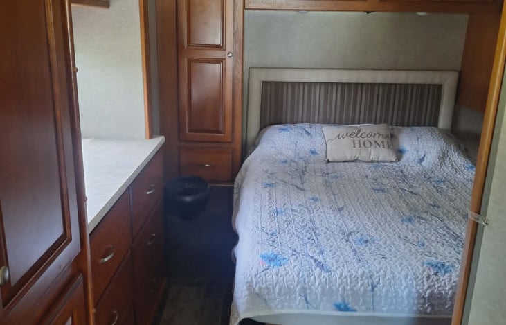 Queen size bed with storage on each side and above