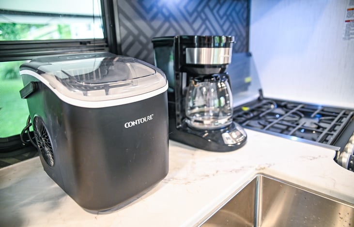 Convenience at your fingertips with an ice maker and coffee pot provided—perfect for keeping drinks cold and starting your day with a fresh cup of coffee.