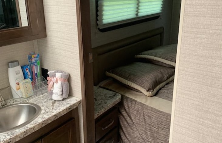 Bathroom door to queen bedroom; door slides and locks.