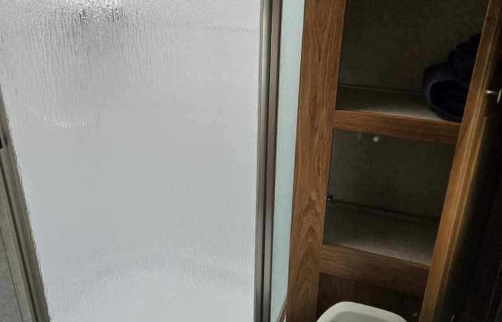 wonderful bathroom in such a small unit. my husband is 6'2" and he can easily use this shower. Also more storage space here