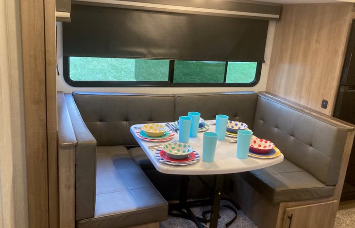 Slide-out dining with U-shaped sitting...also converts to a bed