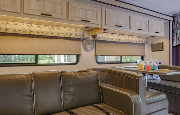 Sofa has cup holders and safety belts. Wide shelf on back of sofa where you can add your own storage boxes.
Extends to bed 43" x 68". There will be a foam mattress topper for added comfort.