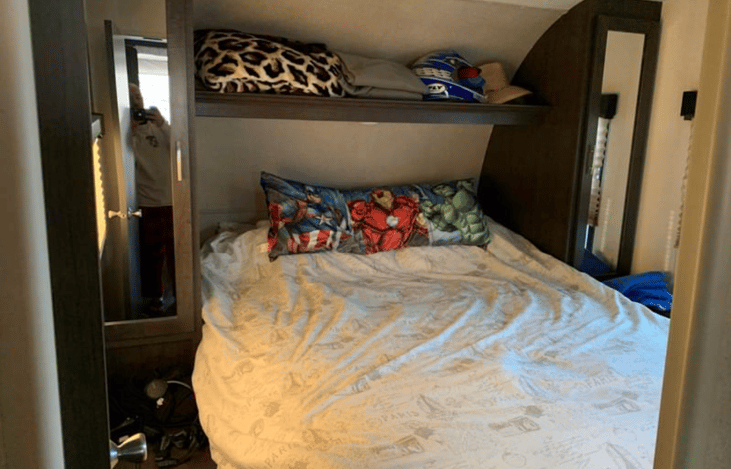 Master bedroom has a queen size bed with a mini closet on each side.  Has its own access door from outside and can go through main room also.