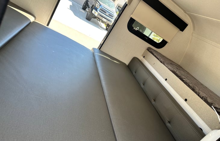 A little larger than a queen size bed with a smal bunk on top for either a small human or dog bed