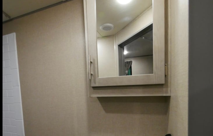 Bathroom mirrored medicine cabinet.