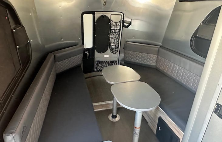 table/bench set-up.  tables drop down to make bed