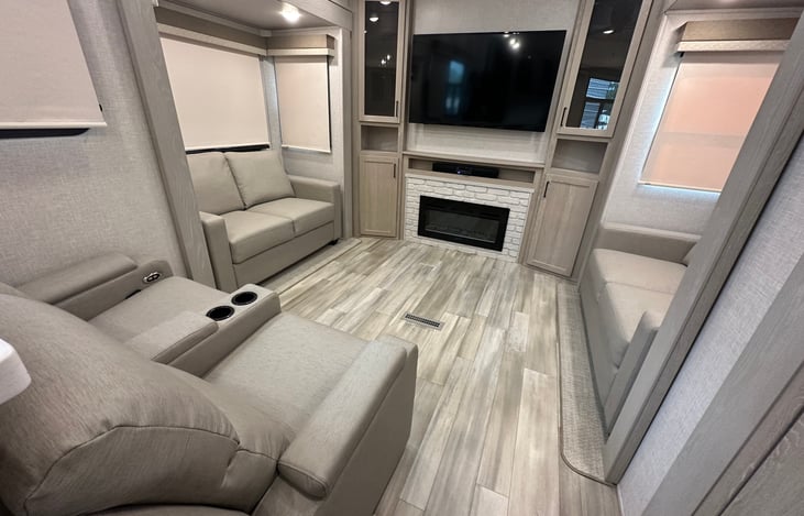 Side couches fold out to create 2 beds