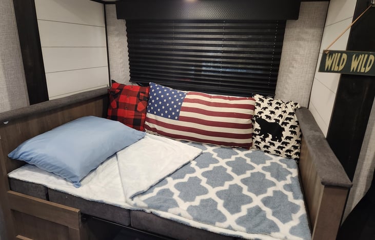 The dinette table converts to additional sleeping space.