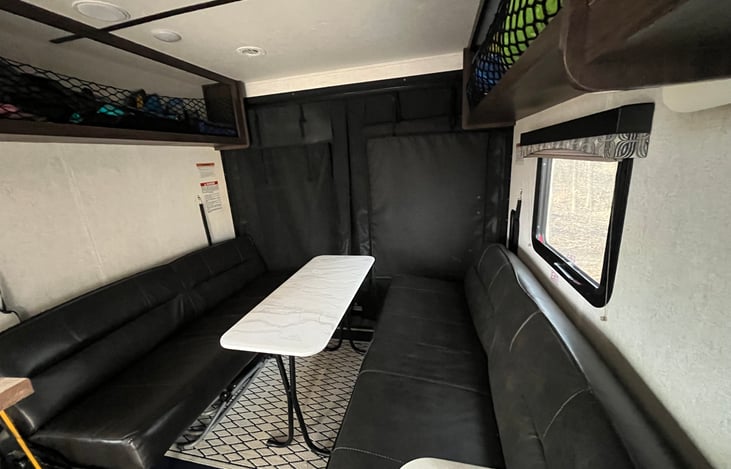 Interior zip up screen allows you to bring the outdoors inside by opening up the toy hauler door.