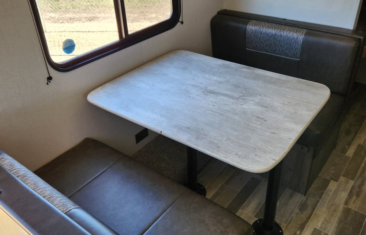 Dinette converts to a Twin size bed and seats 4.