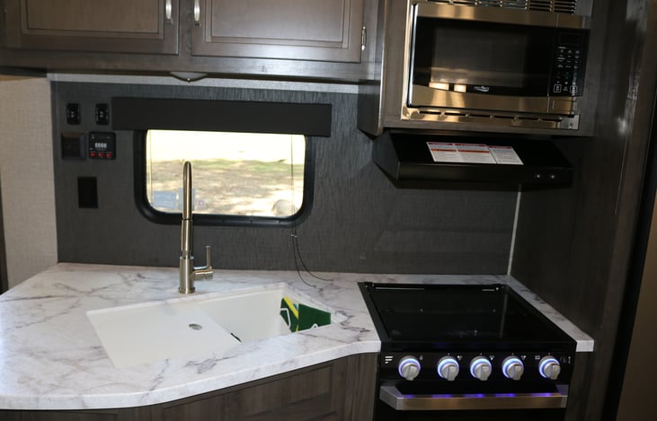 The kitchen is amazing. Stainless appliances and an oversized refrigerator.