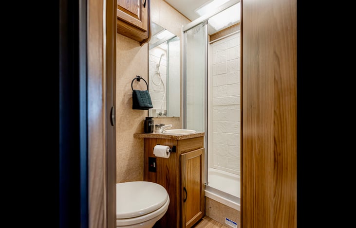 Private bathroom with shower, sink, and toilet. Toilet paper & hand soap provided.