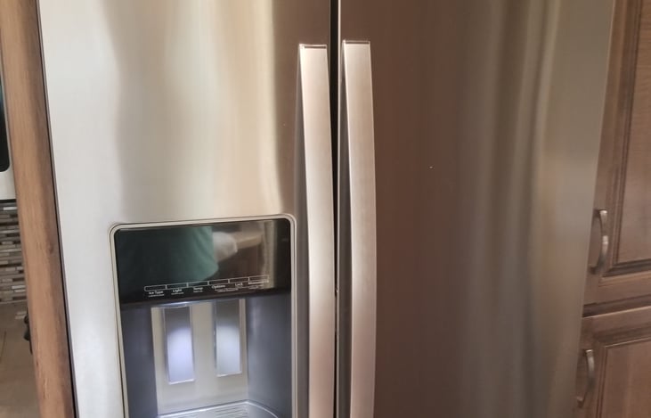 Large residential refrigerator, with triple filtered water and ice machine.