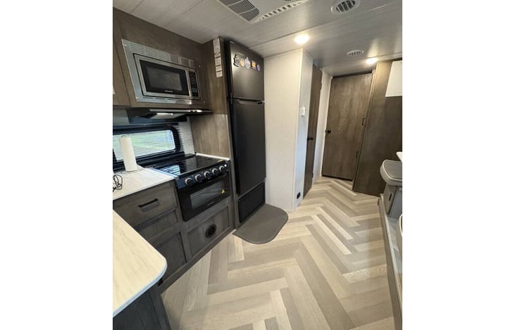 Kitchen with microwave, gas stove/oven, extra large refrigerator and freezer