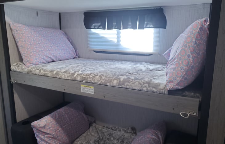Right side of bunk room sleeps one person on top  and 2 kids on the bottom or one adult.