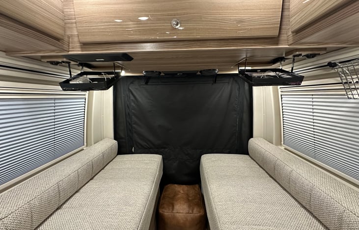 Drop down wire shelves for phones and charging cords.