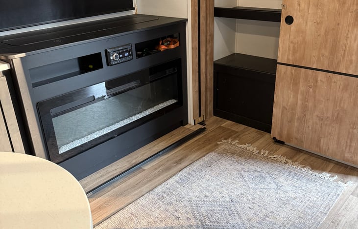 Fireplace with retractable TV