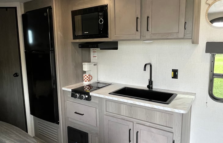 Fridge, Sink, Microwave, Stovetop, Coffee Maker! ( and of course we stock a K cup variety for that morning coffee boost! )