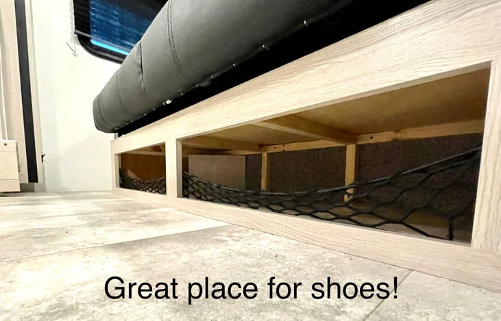 Store shoes and other items in the cubbyhole just below the couch.