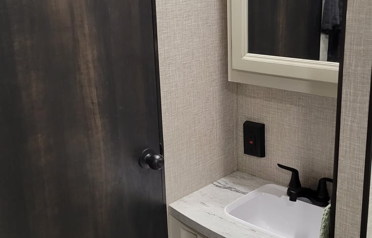 bathroom sink with storage above