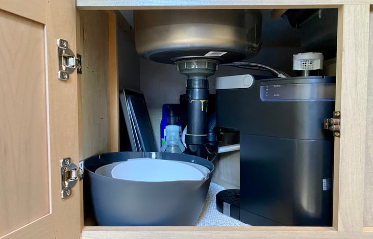 Mixing bowls, cutting board, baking sheets, Keurig coffee maker, and basic cleaning supplies.