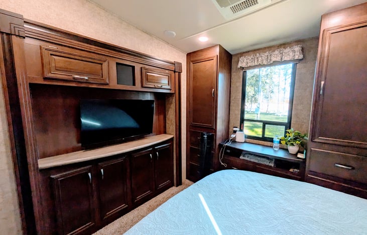 King private bedroom with TV