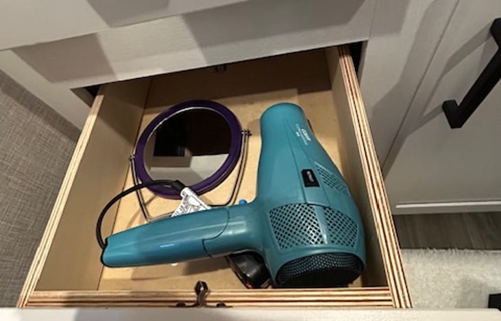 Blow dryer with retractable cord and mirror to get ready on the go!