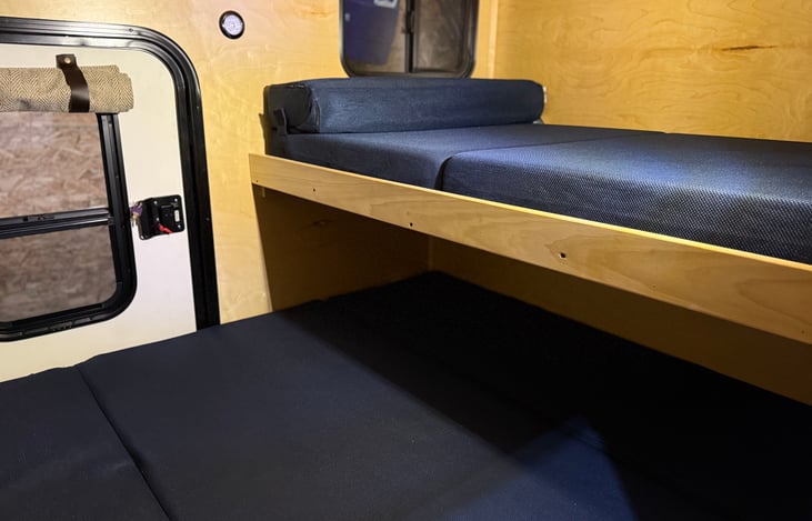 Bunk bed sleeps 2 children or can be folded back into storage shelf.