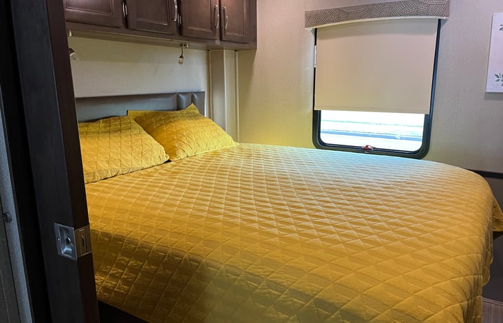 Master bedroom at the rear end of the motor home.