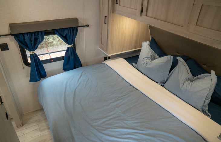 king sized bed, privacy blinds, and black out curtains.