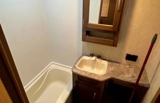 Camper with a queen living space and a bunkhouse.