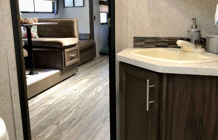 Bathroom always includes a fresh roll of toilet paper, liquid hand soap, fresh bar of bath soap, shampoo and conditioner, hair dryer and clean sanitized towels