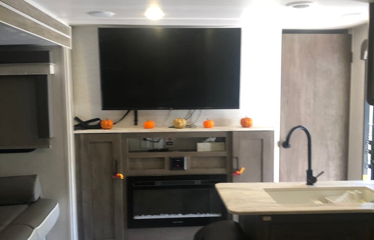 55" TV, with Stereo inside and outside speakers, Fireplace