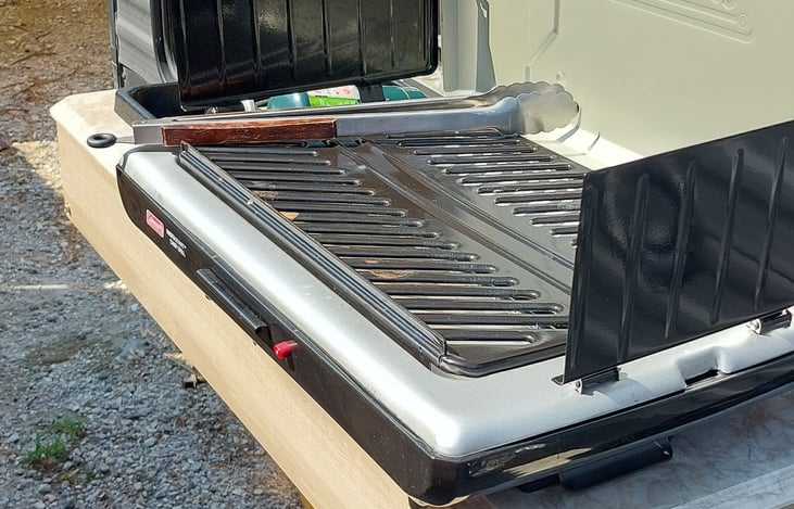 Outdoor kitchen, complete with sink, refrigerator and propane stove