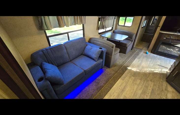 main area with couch that pulls out to another sleep option. the dinette can also be turned into a extra spot for sleeping.