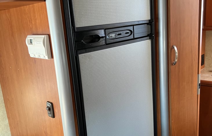 Fridge with separate freezer.  Easy to keep things organized for an extended trip.