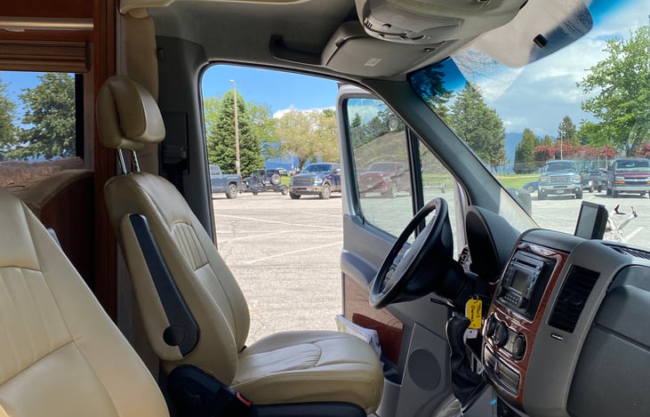 Leonard's comfy leather captain's chairs. These chairs swivel and can face the living quarters. Two extra seats for movie watching!