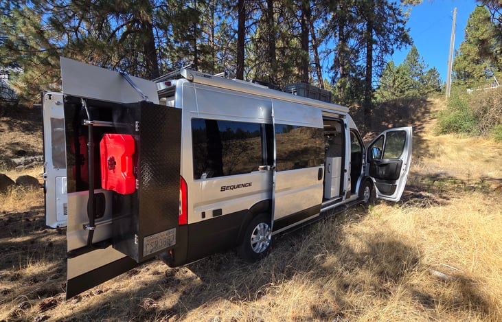 "The Shed" Custom storage and spare fuel can on rear door.