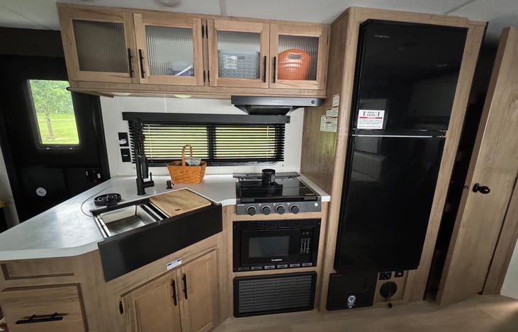 Fully Functional Camper Kitchen with Spacious Pantry.