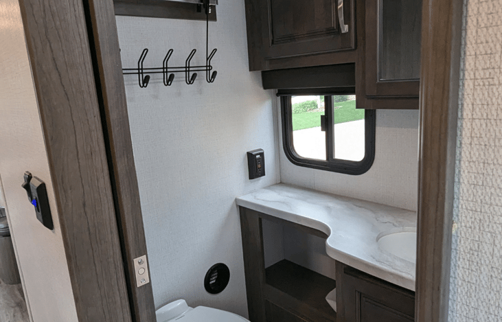 Step flush toilet and bathroom storage