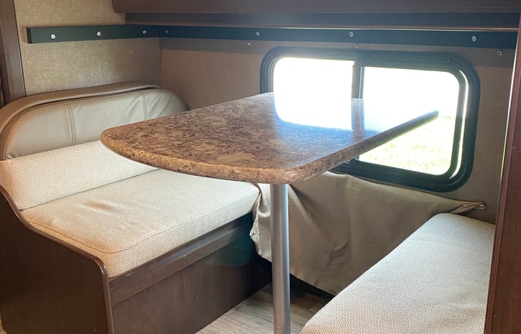 Mini dinette turns into lower bunk with TV