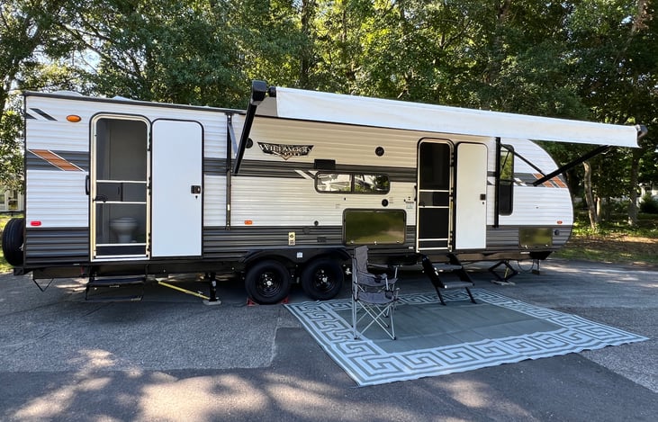 Enjoy the Outdoor Setup. Includes Mat and Four Chairs and Retractable Awning and Music!