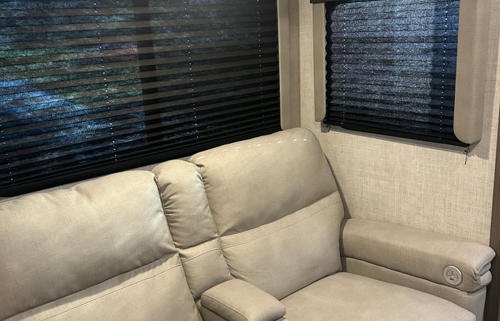 Reclining couch with massaging and heated seats,