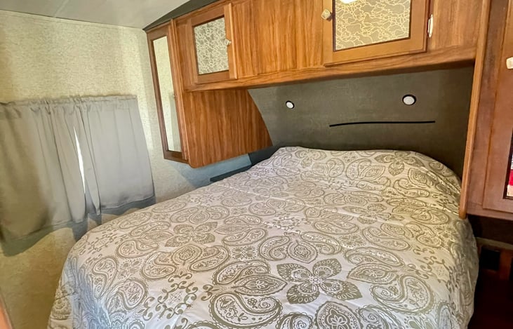 Master bedroom with Queen short memory foam bed! Blackout curtains in all our bedrooms so you can sleep in or enjoy a mid day siesta!